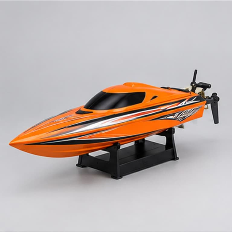 Orange remote control speed boat with display stand on a neutral studio background